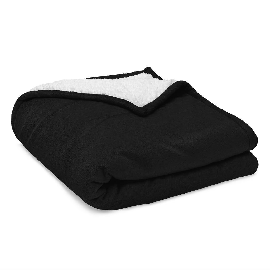 Detail van de geborduurde sherpadeken met zichtbare fleecestructuur